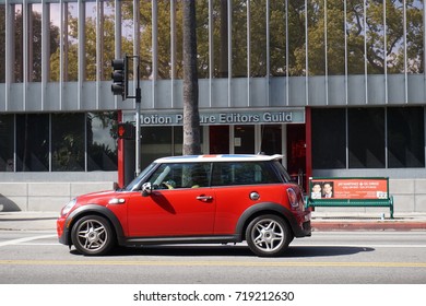 LOS ANGELES, APR 13TH, 2017: A Red Mini Cooper Car Stands In Front Of The Motion Picture Editors Guild Union Building On Sunset Boulevard, Sunset Strip, In Hollywood, California.