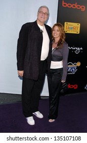 LOS ANGELES - APRIL 12: Phil Jackson And Jeanie Buss At The 3rd Annual Bodog Celebrity Poker Invitational At Barker Hangar On April 12, 2006 In Santa Monica, CA.