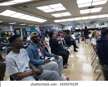 LOS ANGELES, April 25, 2019: DMV Department Of Motor Vehicles Culver City. Long Rows Of Chairs With People Sitting, Waiting Their Turn, Inside The Busy Waiting Room Area.