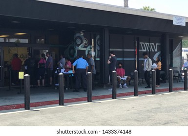 LOS ANGELES, April 25, 2019: DMV Department Of Motor Vehicles Culver City Exterior.  People Waiting In Line Outside The DMV Field Office Building.