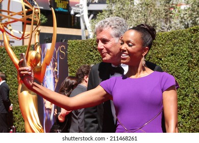 LOS ANGELES - AUG 16:  Anthony Bourdain, Aisha Tyler at the 2014 Creative Emmy Awards - Arrivals at Nokia Theater on August 16, 2014 in Los Angeles, CA
