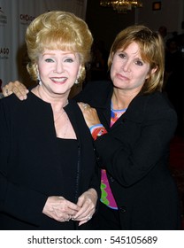 LOS ANGELES -AUG 19:  Debbie Reynolds, Carrie Fisher arrive at the Chicago Themed Fashion Show to Benefit St. Judeâ??s Hospital at a hotel on August 19, 2003 in Beverly Hills, CA 

