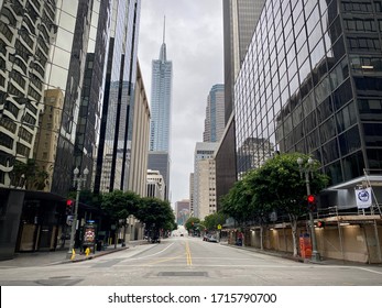 LOS ANGELES, CA, APR 2020: empty Wilshire Blvd at intersection with Grand Av in Downtown during coronavirus, Covid-19 lockdown and stay at home orders. Wilshire Grand skyscraper visible, center