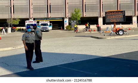 LOS ANGELES, CA, APR 2021: Security Staff Guiding People At Cal State LA Campus, Johnson And Johnson (Janssen) Vaccination Site For Covid-19