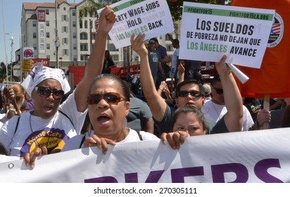 LOS ANGELES, CA  APRIL 15, 2015: Protestors Shout And Hold Signs Advocating Raising The Minimum Wage At During A Rally In Los Angeles On April 15, 2015.