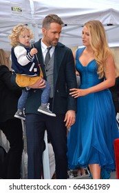 LOS ANGELES, CA - DECEMBER 15, 2016: Actor Ryan Reynolds & wife actress Blake Lively & daughter James Reynolds (2) at the Hollywood Walk of Fame Star Ceremony honoring actor Ryan Reynolds.

