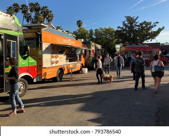 Los Angeles, CA: January 13, 2017:  Food Trucks And Crowd Of Patrons In A Parking Lot In The Los Feliz Area Of Los Angeles.  Food Trucks Have Become Very Popular For Many Americans In Recent Years.