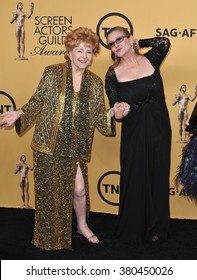 LOS ANGELES, CA - JANUARY 25, 2015: Debbie Reynolds & daughter Carrie Fisher at the 2015 Screen Actors Guild  Awards at the Shrine Auditorium.