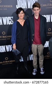 LOS ANGELES, CA - JANUARY 30, 2017: Carrie-Anne Moss & Owen Roy at the premiere of "John Wick Chapter Two" at the Arclight Theatre, Hollywood.