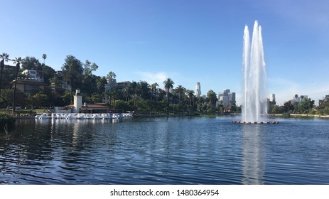 LOS ANGELES, CA, JUL 2019: View Across The Lake At Echo Park Recreation Center, Looking Past Fountain Towards Downtown LA