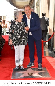 LOS ANGELES, CA. July 24, 2019: Kenny Ortega & Madeline Ortega at the Hollywood Walk of Fame Star Ceremony honoring Kenny Ortega.Pictures: Paul Smith/Featureflash