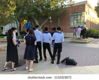 Los Angeles, CA: June 10, 2018: UCLA Graduates Waiting In Line For A Photographer To Take Graduation Photos.   UCLA Is A Public University In The Los Angeles Area.