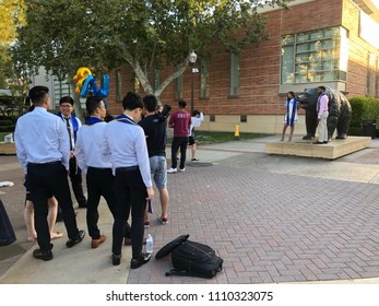 Los Angeles, CA: June 10, 2018: UCLA Graduates Waiting In Line For A Photographer To Take Graduation Photos.   UCLA Is A Public University In The Los Angeles Area.