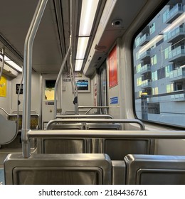 LOS ANGELES, CA, MAR 2022: Interior E-Line, Expo Line, Train Car On LA Metro With Destinations On Screen And New Apartments Visible Through Window, Day Time