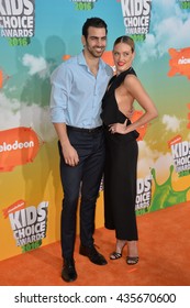 LOS ANGELES, CA - MARCH 12, 2016: Dancer Peta Murgatroyd & Actor Nyle DiMarco At The 2016 Kids' Choice Awards At The Forum, Los Angeles.
