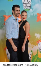 LOS ANGELES, CA - MARCH 12, 2016: Dancer Peta Murgatroyd & Actor Nyle DiMarco At The 2016 Kids' Choice Awards At The Forum, Los Angeles.
