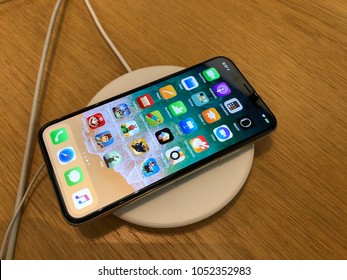 Los Angeles, CA: March 16, 2018: An Iphone X On A Wireless Charger At An Apple Store. The Iphone 8, 8S And Iphone X Are The First Apple Phones That Support Wireless Charging.