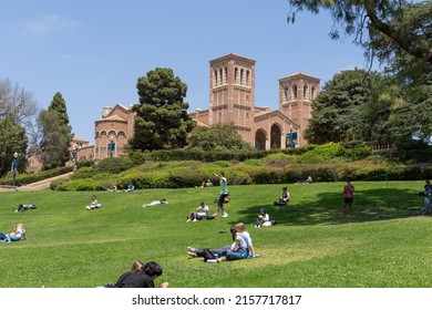 Los Angeles, CA - May 17 2022:  Students Relax On A Sunny Day At UCLA With A Student Walking On A Tightrope