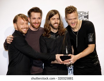 LOS ANGELES, CA - NOVEMBER 23, 2014: Ben McKee, Daniel Platzman, Daniel Wayne Sermon And Dan Reynolds Of Imagine Dragons At The 2014 American Music Awards Held At The Nokia Theatre L.A. Live.