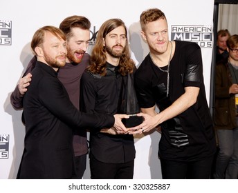 LOS ANGELES, CA - NOVEMBER 23, 2014: Ben McKee, Daniel Platzman, Daniel Wayne Sermon And Dan Reynolds Of Imagine Dragons At The 2014 American Music Awards Held At The Nokia Theatre L.A. Live.