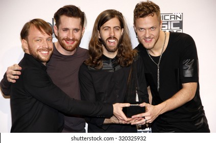 LOS ANGELES, CA - NOVEMBER 23, 2014: Ben McKee, Daniel Platzman, Daniel Wayne Sermon And Dan Reynolds Of Imagine Dragons At The 2014 American Music Awards Held At The Nokia Theatre L.A. Live.