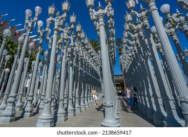 LOS ANGELES, CA - October 17, 2021: View from the famous public art named 'Urban Light' by Chris Burden featuring 202 streetlamps located at Wilshire Blvd.