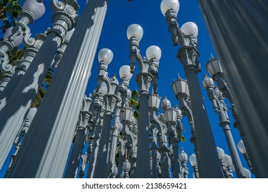 LOS ANGELES, CA - October 17, 2021: View from the famous public art named 'Urban Light' by Chris Burden featuring 202 streetlamps located at Wilshire Blvd.
