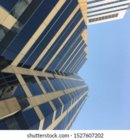 LOS ANGELES, CA, SEPT 2019: looking up at tall office buildings with blue sky behind, Wilshire Blvd in Westwood area