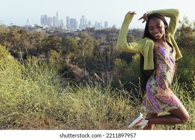 Los Angeles, CA, USA 10-05-22 Happy Girl With Downtown LA Skyline In The Background