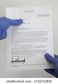 Los Angeles, CA / USA - April 26, 2020: A Letter From The White House With A Printed Signature By President Donald Trump Is Shown, Confirming Direct Deposit Payment Sent As Part Of The CARES Act.