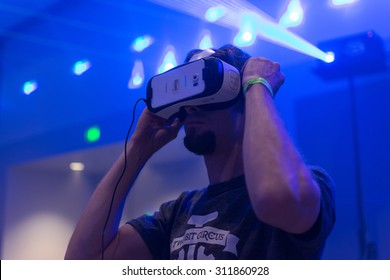 Los Angeles, CA - USA - August 29, 2015: Guy Tries Virtual Glasses Headset During VRLA Expo, Virtual Reality Exposition, Event At The Los Angeles Convention Center In Los Angeles.