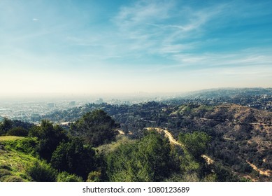 Los Angeles, CA, USA - February 02, 2018: view of the Hollywood Hills and downtown Los Angeles smoggy cityscape view.