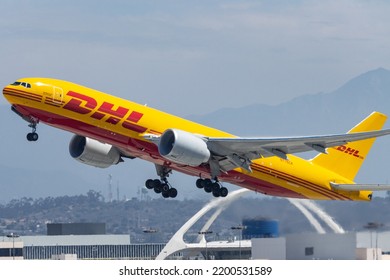 Los Angeles, CA, USA, July 2022: A Yellow DHL Boeing 777f Cargo Plane Taking Off From Los Angeles Airport (LAX)