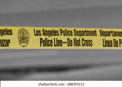 Los Angeles, CA / USA - June 8, 2017: Los Angeles Police Department Police Line - Do Not Cross tape is displayed at the scene of a major motor vehicle collision.