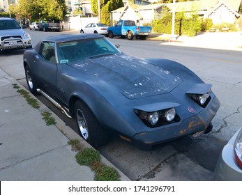 LOS ANGELES, CA / USA - May 14, 2020: A Vintage Chevrolet Corvette C3 Stingray Serving As An Uber Ride Share Vehicle.