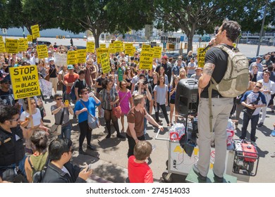 Los Angeles, CA, USA - May 02, 2015: Protestant Talking To Others During March Against The Death Of Freddie Gray, A Man Of Baltimore Who Was Seriously Injured In Police Custody.