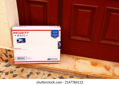 Los Angeles, California – April 20, 2022: USPS United States Postal Service  PRIORITY MAIL Mailing Box Delivered At Home To The Front Door