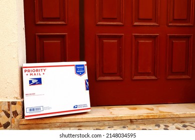 Los Angeles, California – April 20, 2022: USPS United States Postal Service  PRIORITY MAIL Mailing Box Delivered At Home To The Front Door