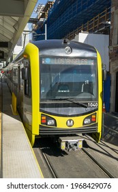 Los Angeles, California - December 21, 2017: A Metro Light Rail Train Waits At The Station While Being Boarded.