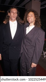 Los Angeles, California - Exact Date Unknown - Circa 1990: Musicians Michael Bolton And Kenny G Posing At A Formal Celebrity Event