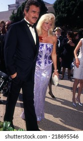 LOS ANGELES, CALIFORNIA - exact date unknown - circa 1991:  Burt Reynolds and Loni Anderson arriving at a celebrity event