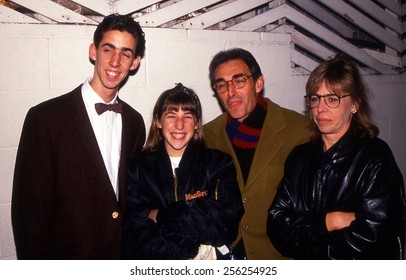 Los Angeles, California - Exact Date Unknown - Circa 1990 - A Young Mayim Bialik With Her Family Posed Outside Of A Restaurant