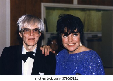 LOS ANGELES, CALIFORNIA - EXACT DATE UNKNOWN - CIRCA 1990 - Very Rare Photo Of Andy Warhol And Joanne Worley Attending A Celebrity Event