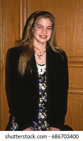 LOS ANGELES, CALIFORNIA - Exact Date Unknown - Circa 1990 - A Young Anna Chlumsky Arriving At A Celebrity Event