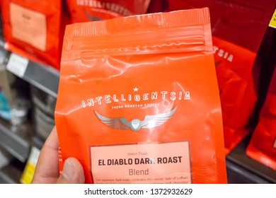 Los Angeles, California, United States: 04-07-2019: A View Of A Hand Holding A Package Of Intelligentsia Coffee Beans, On Display At The Grocery Store.