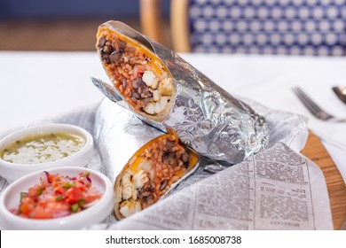 Los Angeles, California, United States - 05-09-2019: A View Of A Chicken Burrito And Condiments.