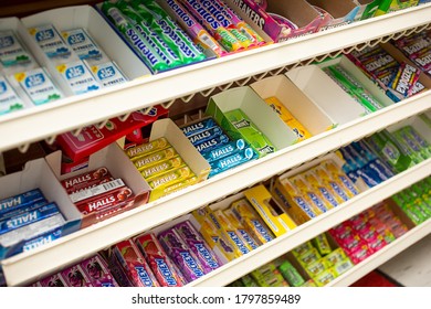 Los Angeles, California, United States - 07-22-2020: A view of several packages of candies and mints, at the checkout lane shelves seen at a local liquor store.