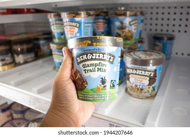 Los Angeles, California, United States - 03-18-2021: A View Of A Hand Holding A Carton Of Ben And Jerry's Glampfire Trail Mix Ice Cream, On Display At A Local Grocery Store.