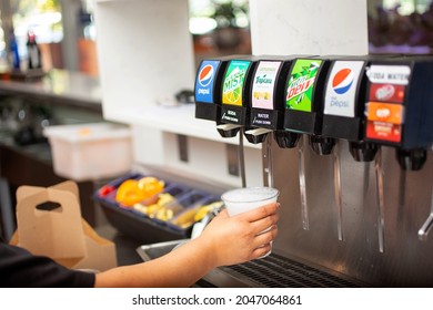 Los Angeles, California, United States - 09-23-2021: A View Of A Hand Holding A Plastic Cup, Filling Up The Cup With Sierra Mist Soda Under A Restaurant Soda Fountain.