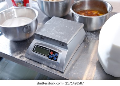 Los Angeles, California, United States - 05-20-2022: A view of a Bakers Math KD-8000 kitchen scale, among other baking ingredients.